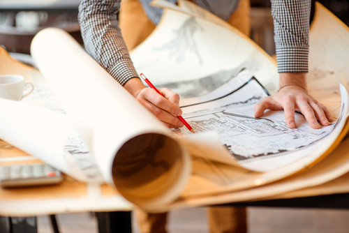 guy working on floor plans